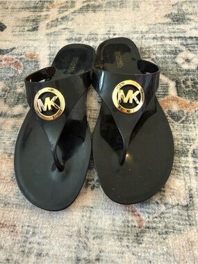 Michael Kors Black Jelly Thong Sandals with Gold MK Medallions